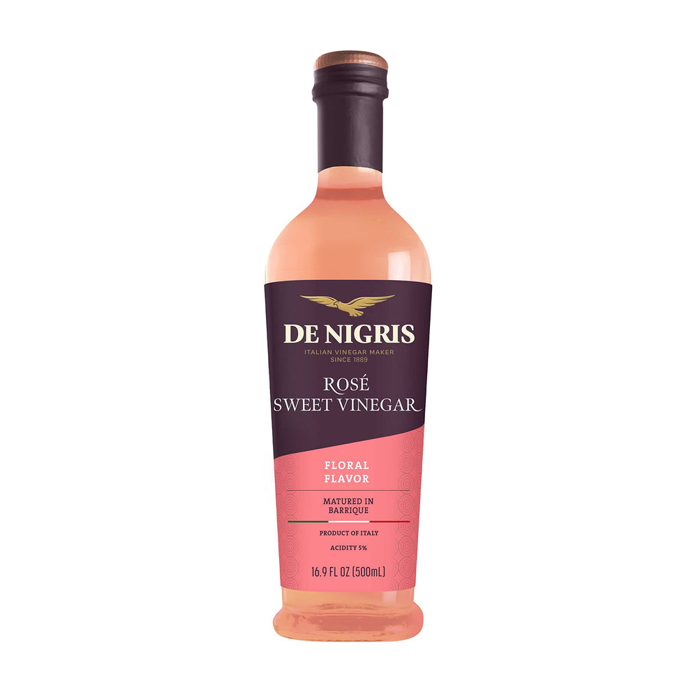 De Nigris Sweet Rosé Wine Vinegar bottle pour, ideal for fresh dressings.