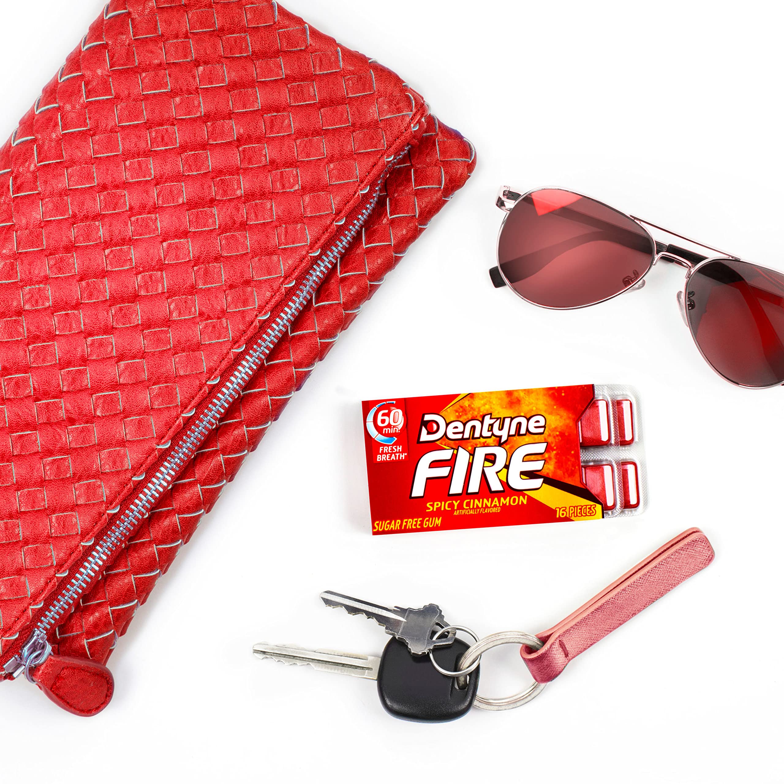 Car dashboard image with Dentyne Fire, convenient breath refresh during travel.