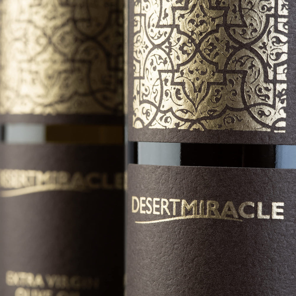 DESERTMIRACLE oil glass hero showcasing premium finishing oil