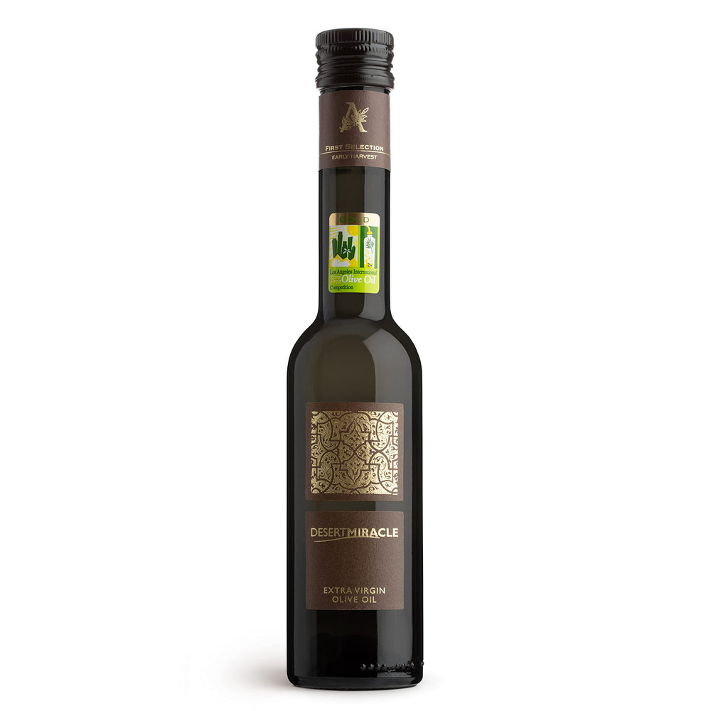 DESERTMIRACLE olive oil bottle pour showing a smooth finish for finishing dishes