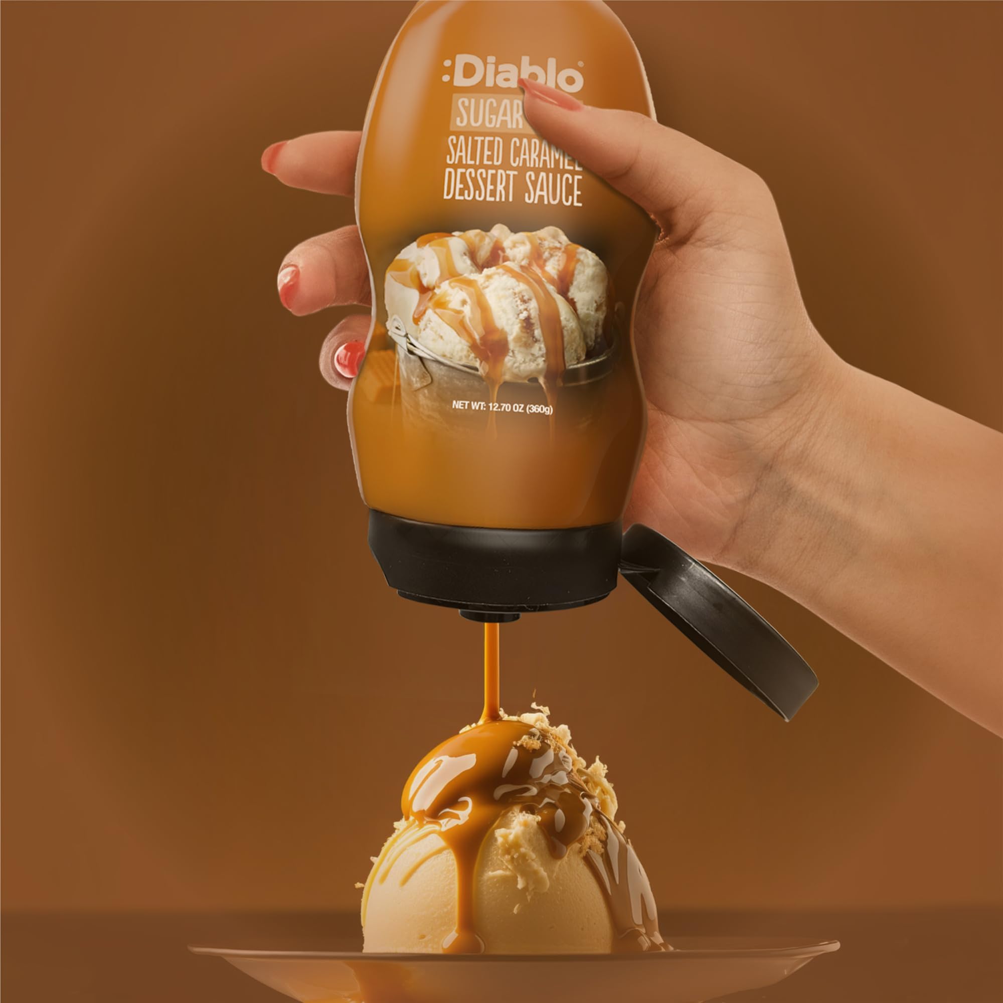 Diablo Sugar Free Salted Caramel ice cream topping on creamy vanilla scoop.