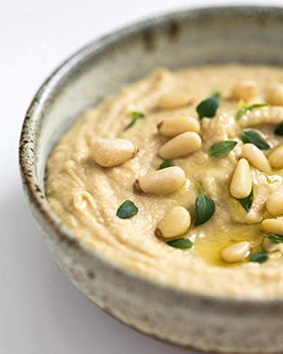 Raw Diamond of California pine nuts close-up showcasing non-GMO quality.
