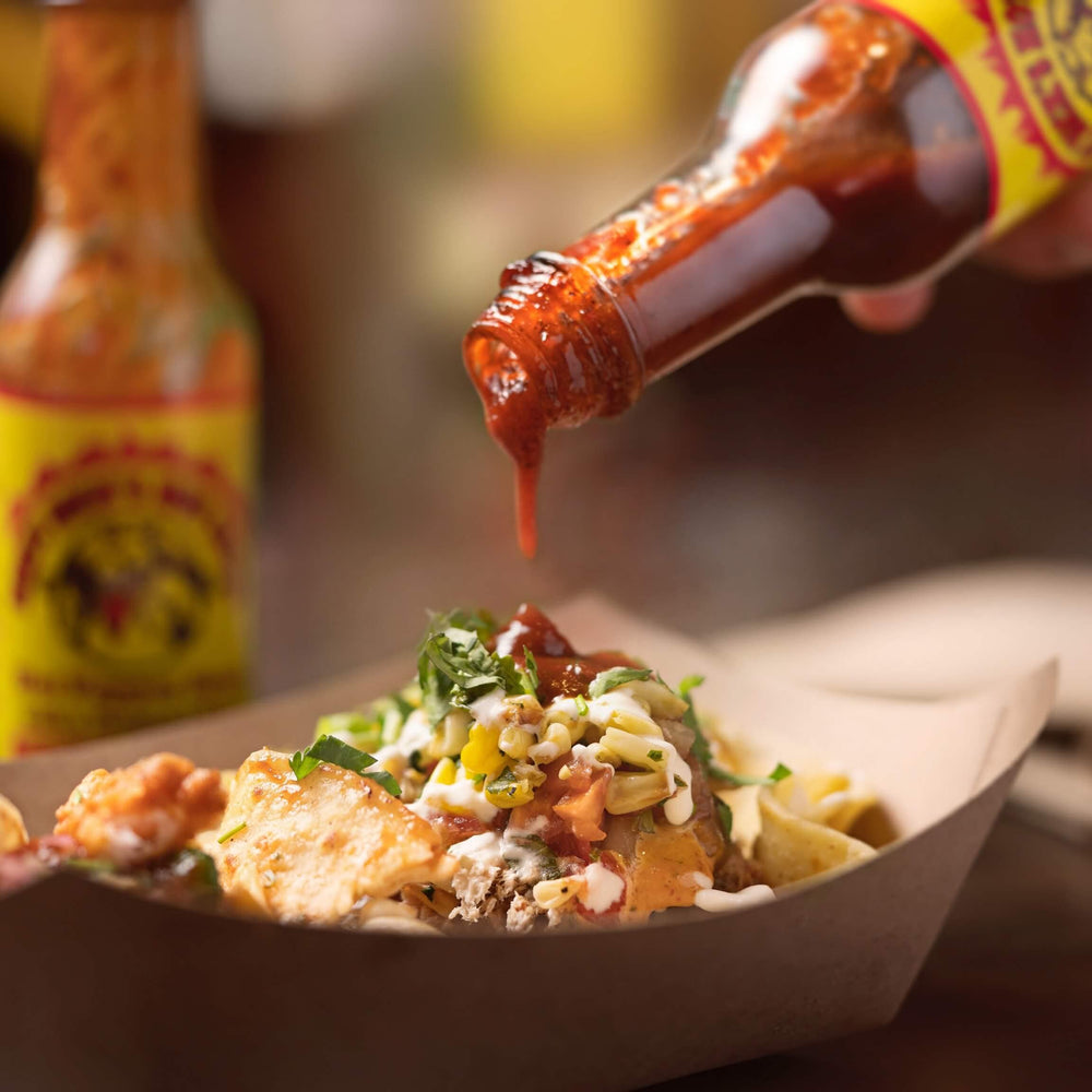 Dirty Dicks Original Hot Sauce paired with grilled dishes for vibrant flavor
