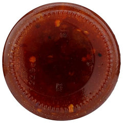 Divina Calabrian Chili Orange Spread on a cheese board, perfect for entertaining
