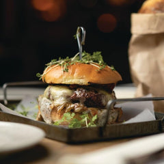 Divina caramelized onion jam on a grilled burger, a sweet-savory glaze