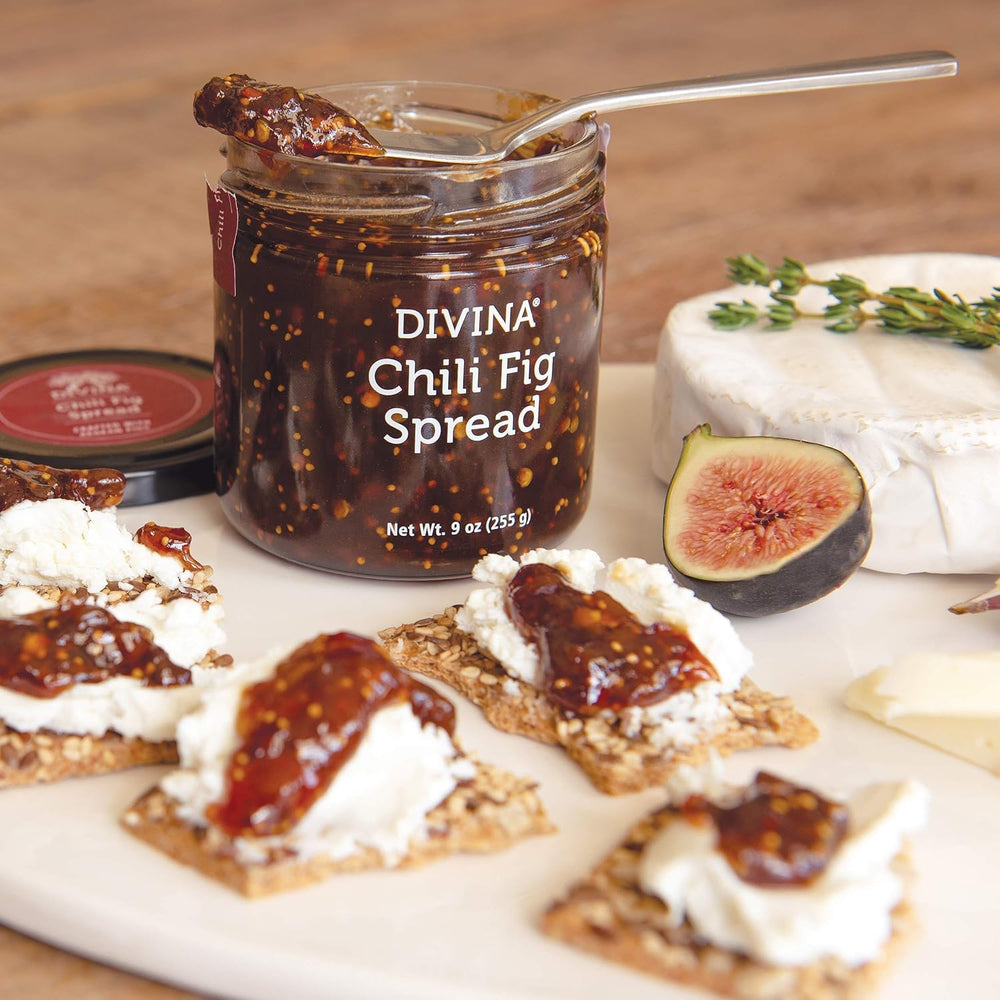 Divina Chili Fig Spread Jam served with crackers and cheese.
