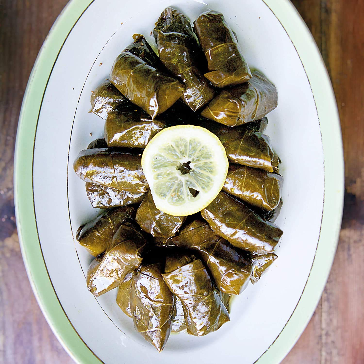 Divina Dolmas served with feta and pita, a classic Mediterranean starter
