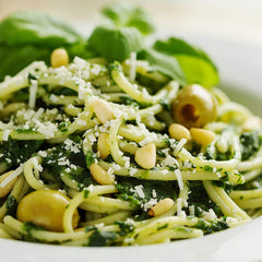 Divina green olives close-up shows glossy skin and fresh aroma.