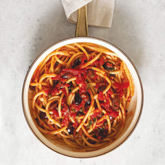 Divina Organic Kalamata olives sliced in a salad bowl elevate everyday meals.