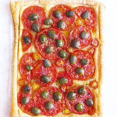 Divina olives on a brunch platter with cheese and veggies.