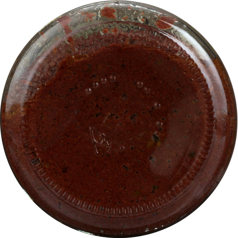 Divina Organic Kalamata Olive Spread jar with spoon ideal for savory spreads.