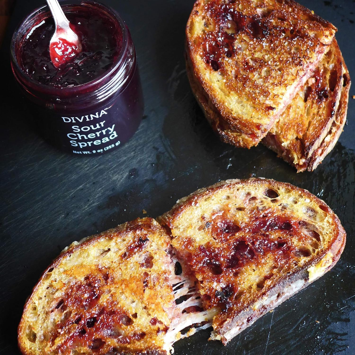 Jam spread on scone or pastry elevates breakfast moments.
