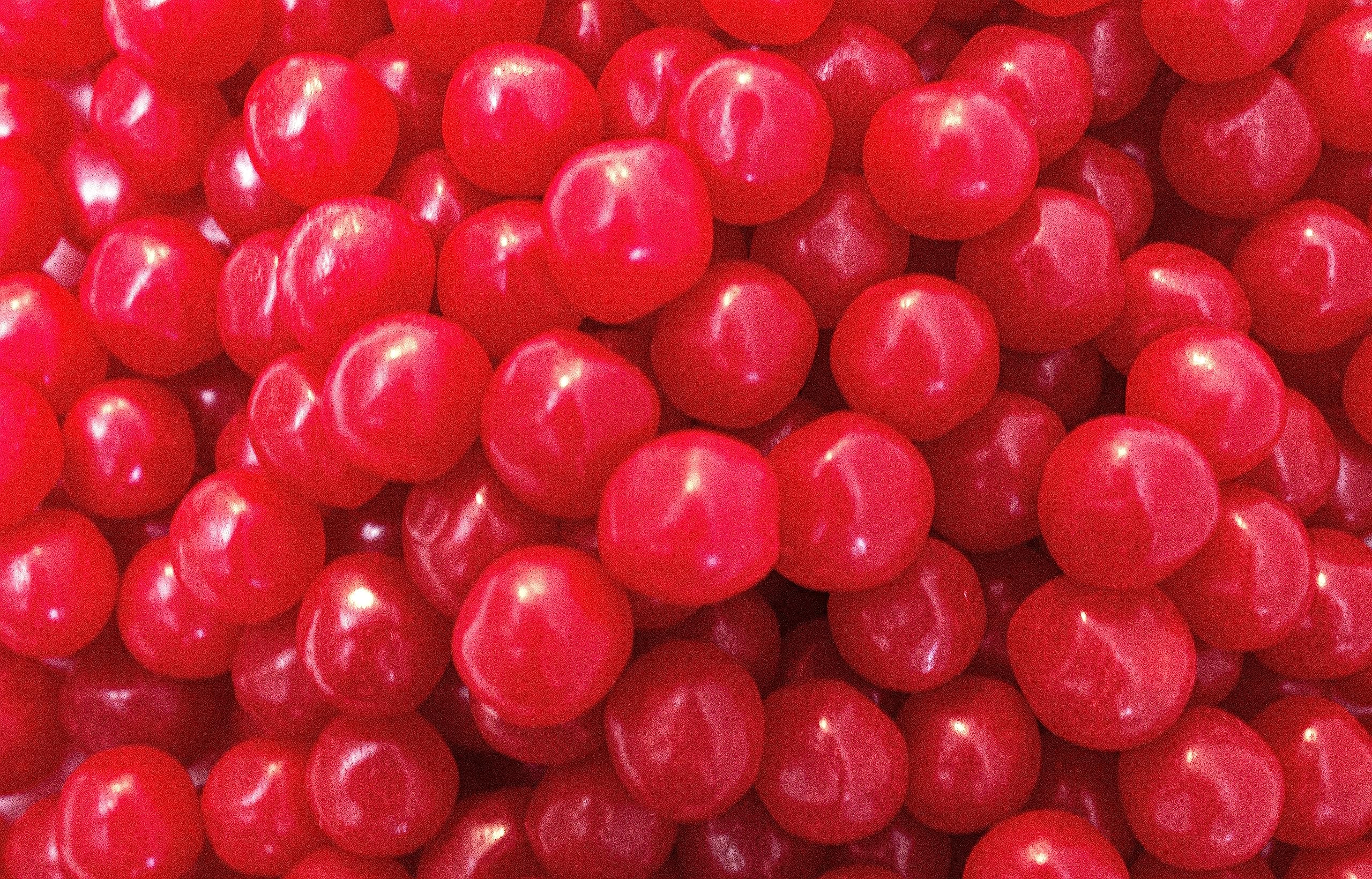 DM Sweets Cherry Sours bag front view highlights chewy texture for snack time