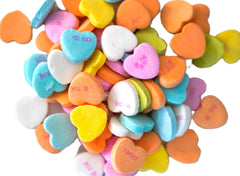 DM Sweets conversation hearts close-up shows crunchy texture and printed messages