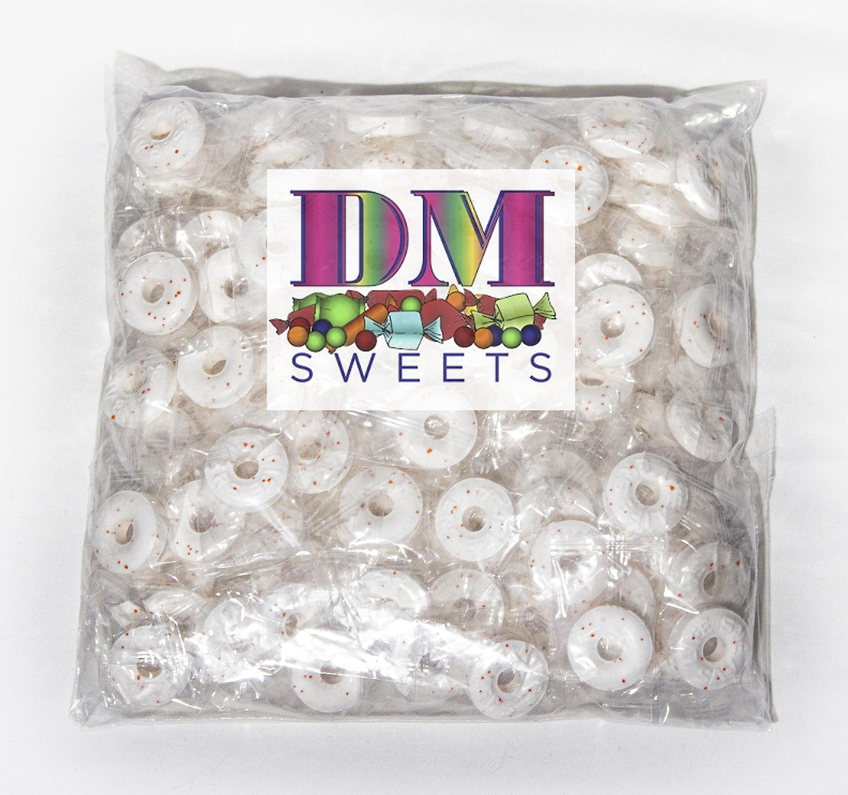 DM Sweets Orange Mints closeup of individually wrapped hard candy for easy snacking.