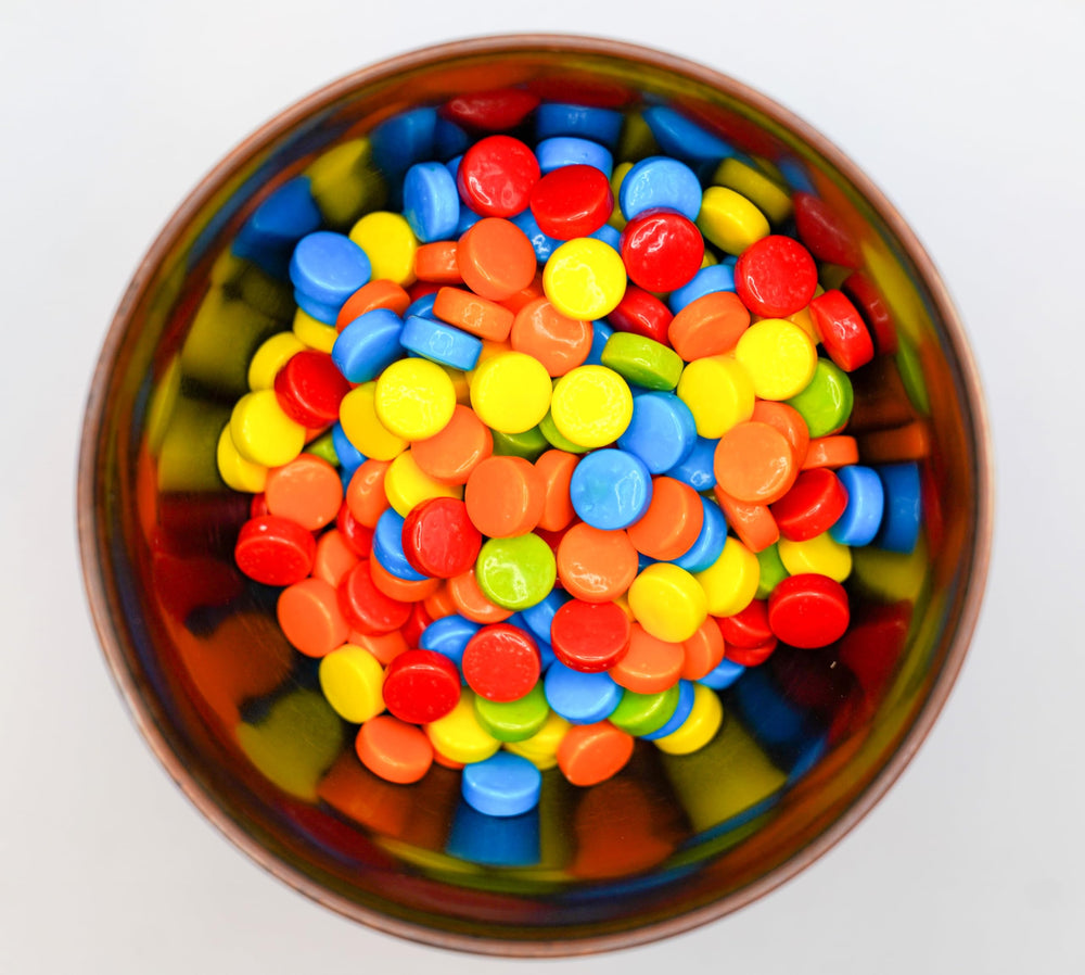 DM Sweets rainbow pucker candy serving dish display adds color to events.