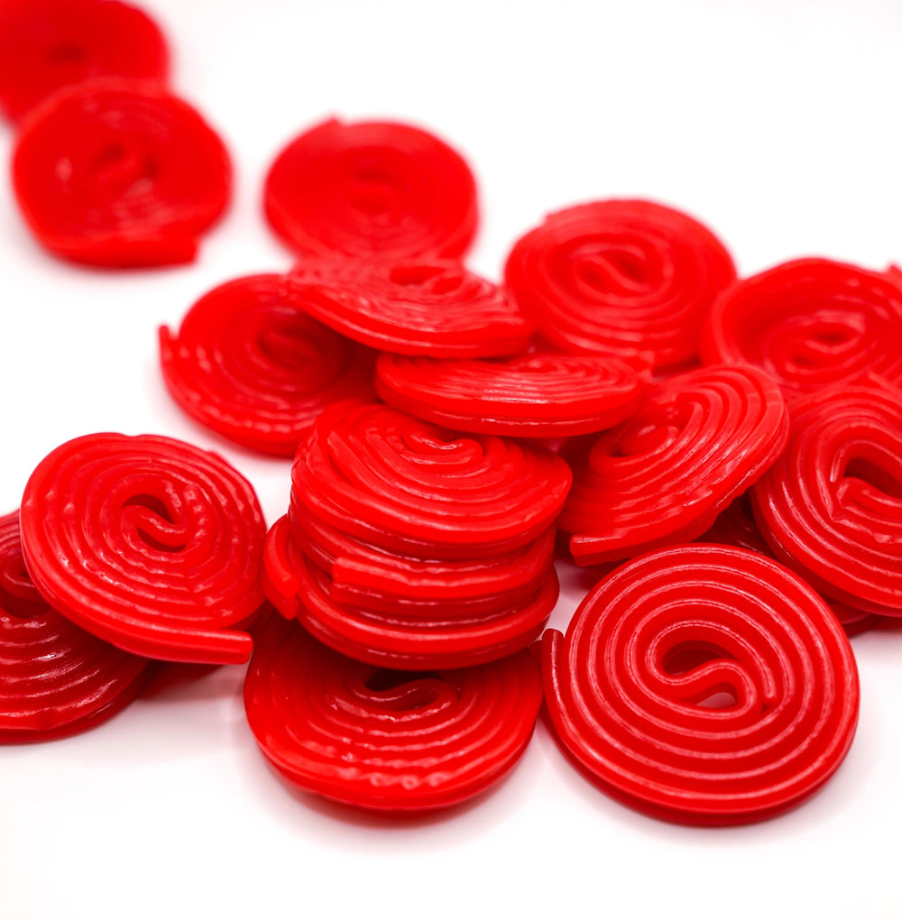 DM Sweets Red Strawberry Licorice Wheels in a bag, fresh and ready to enjoy.