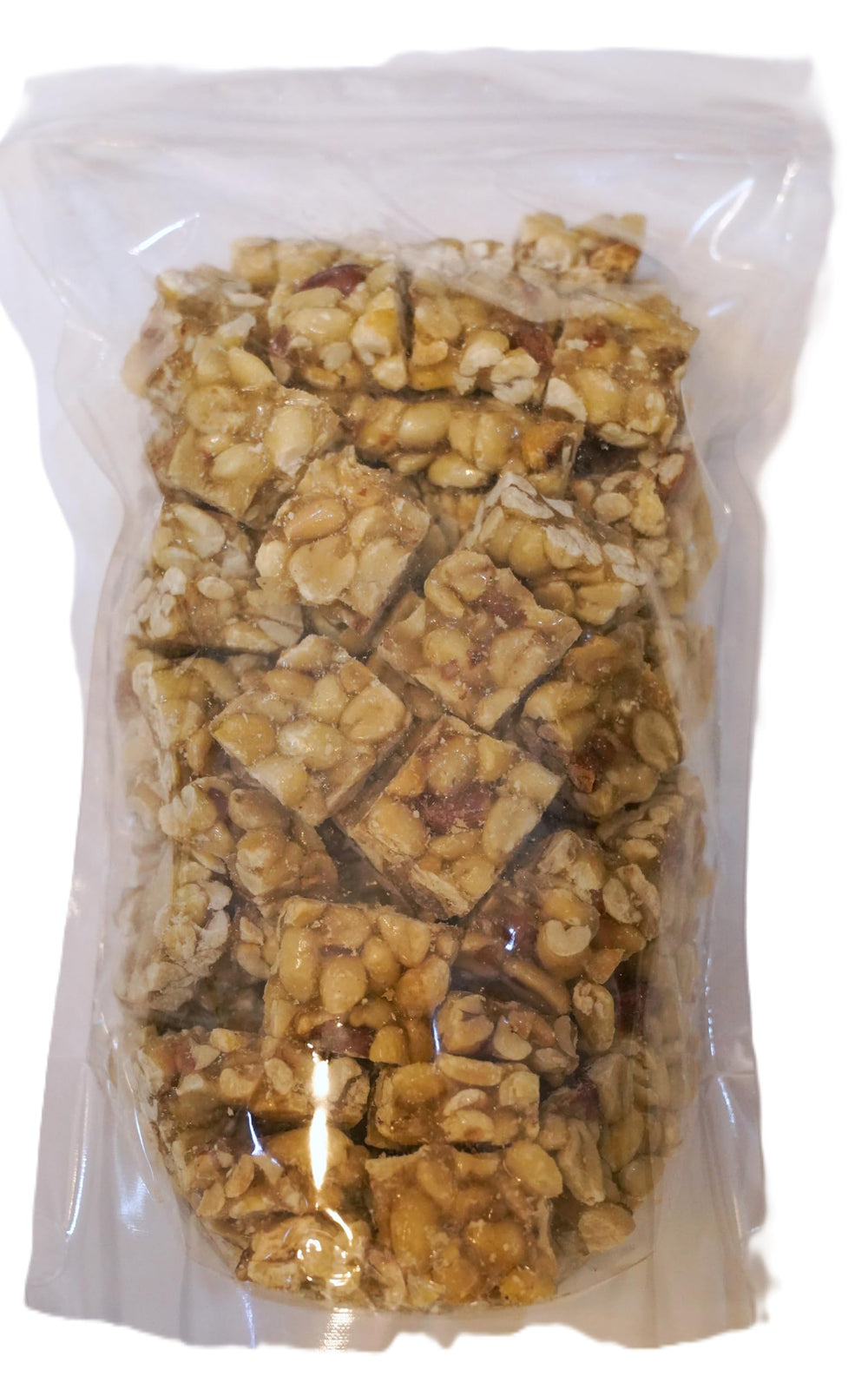 Holiday candy dish featuring DM Sweets peanut squares for festive snacking.