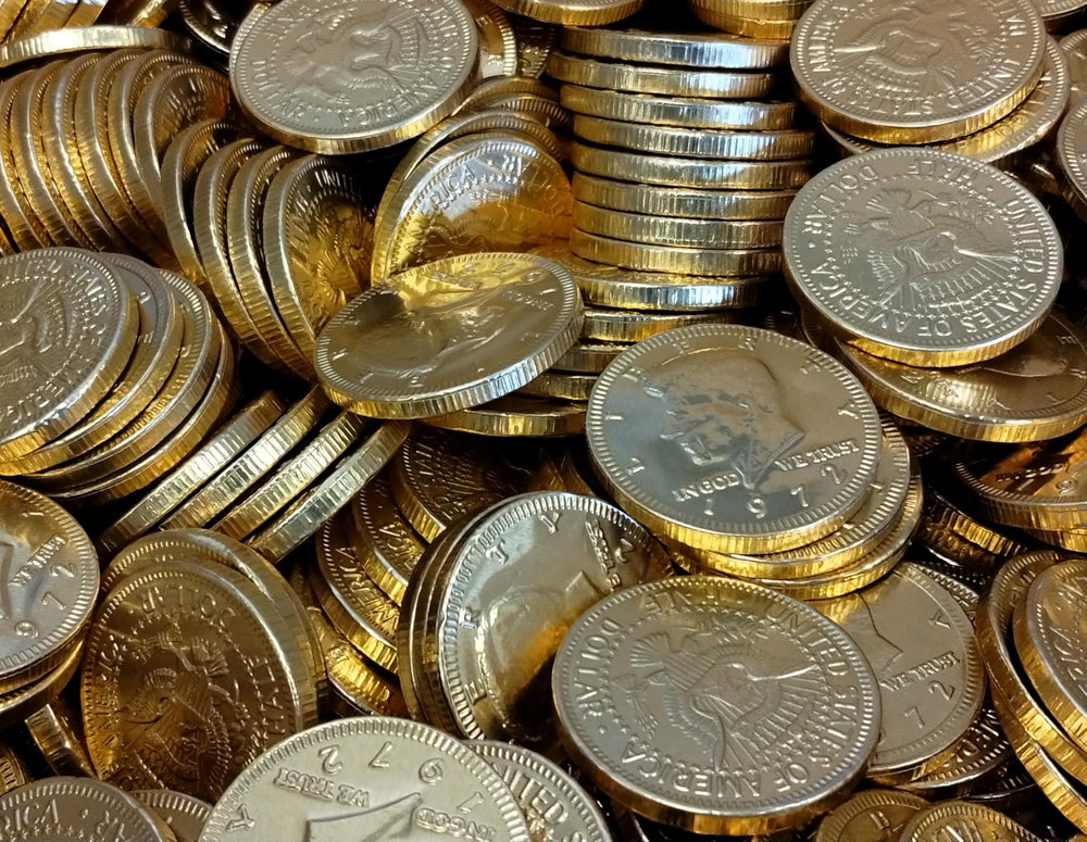 Gold foil-wrapped DM Sweets coins on a festive display.
