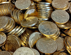 Gold foil-wrapped DM Sweets coins on a festive display.