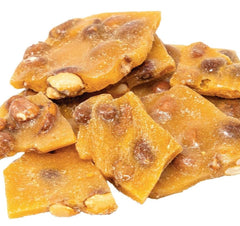 DM Sweets peanut brittle smooth-creamy-bite highlighting rich texture and flavor