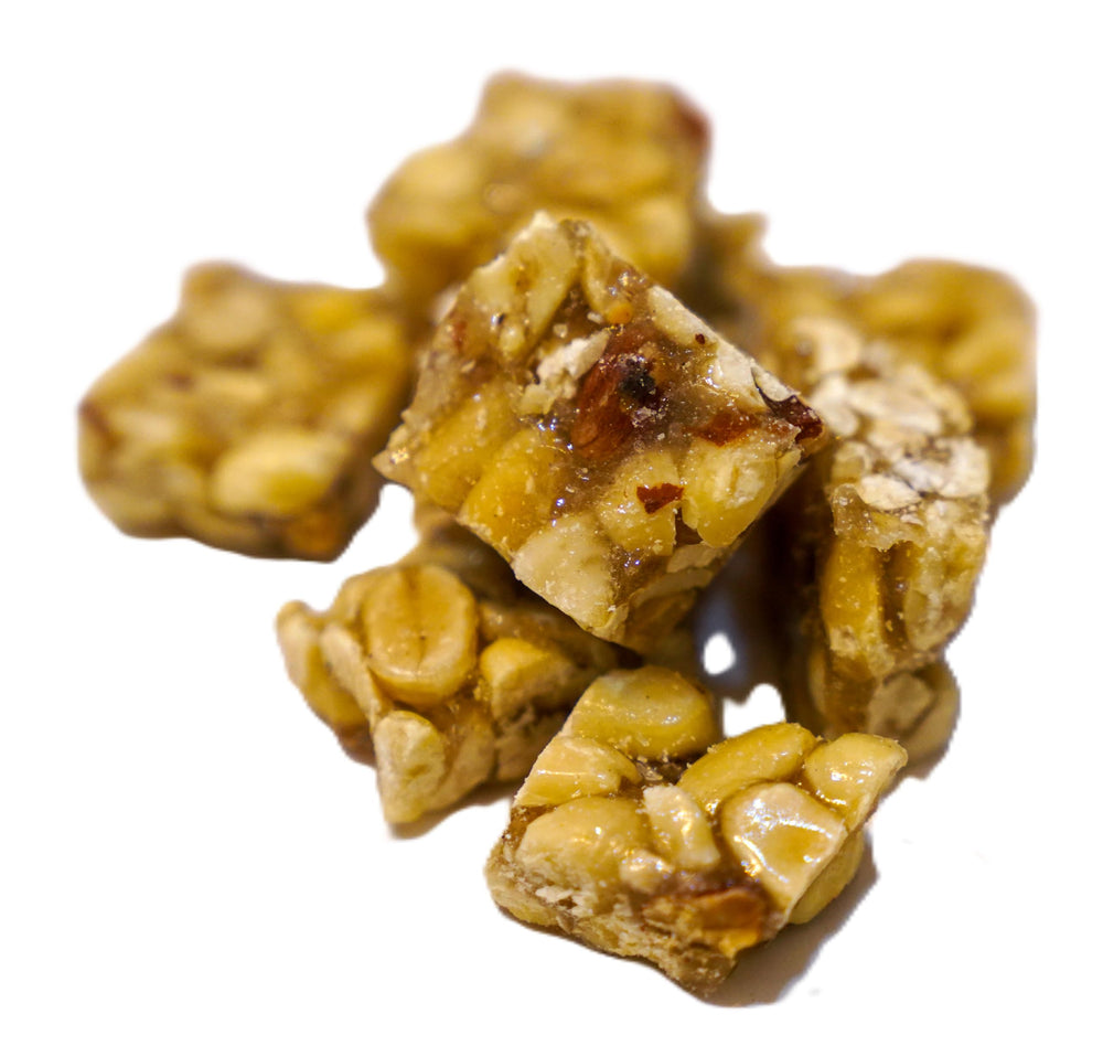 DM Sweets peanut squares arranged on a plate for sharing at gatherings.