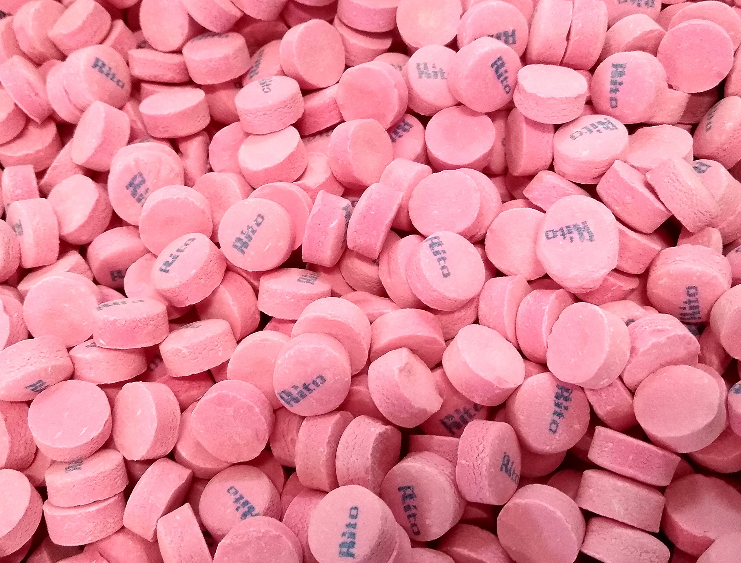 DM Sweets Pink Wintergreen lozenge on kitchen counter for snacking