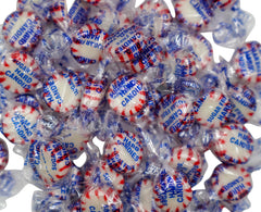 DM Sweets Sugar Free Peppermint Starlights candies displayed on a countertop for gatherings.
