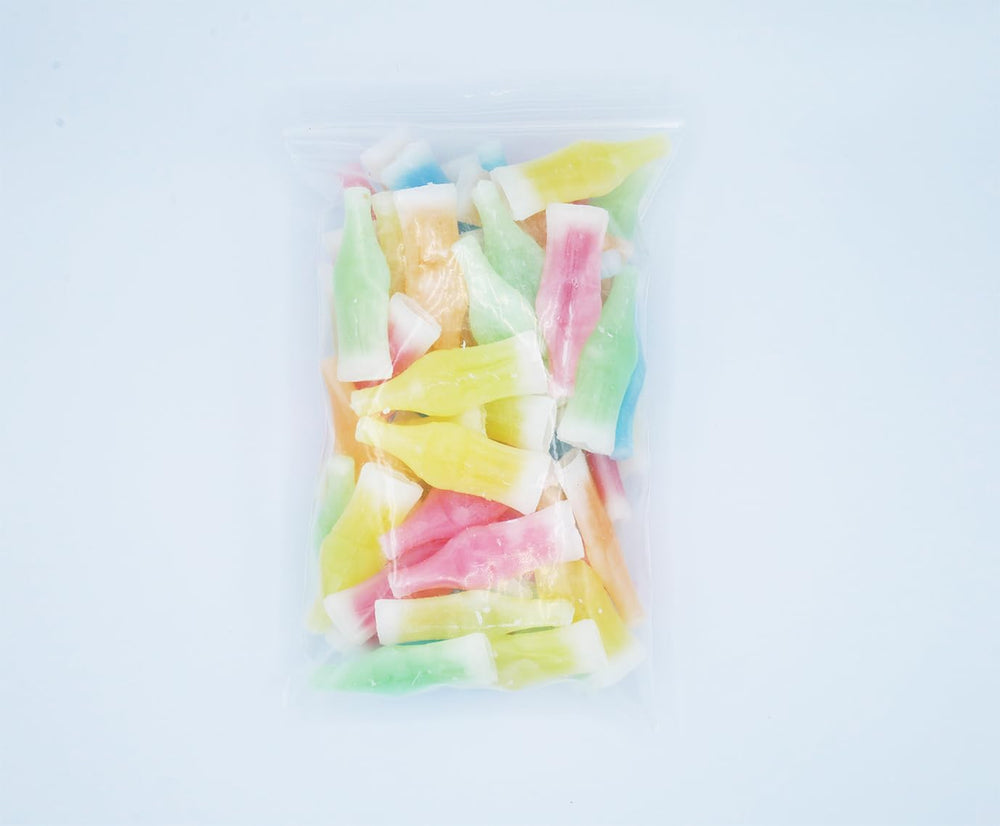 Nik-L-Nip fruity flavors display blue raspberry, cherry, orange, lemon, green