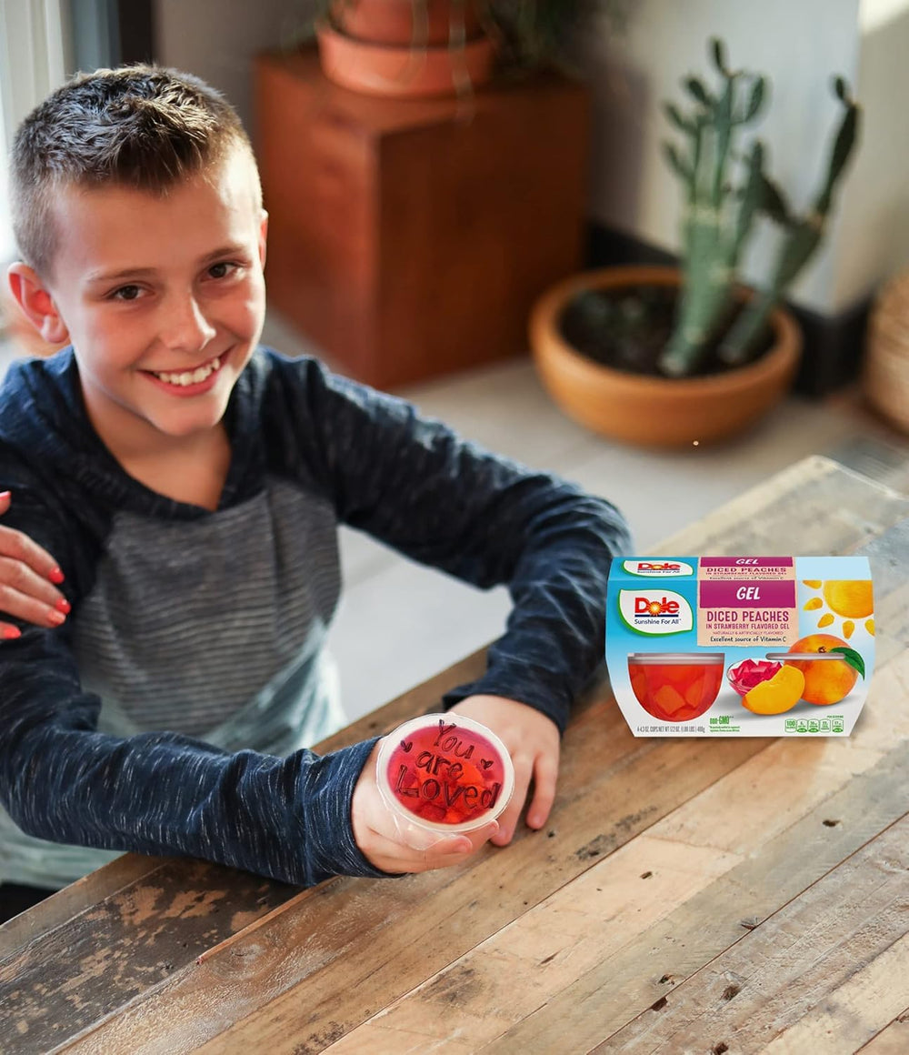 Tabletop display of Dole peaches in strawberry gel cups set for easy selection