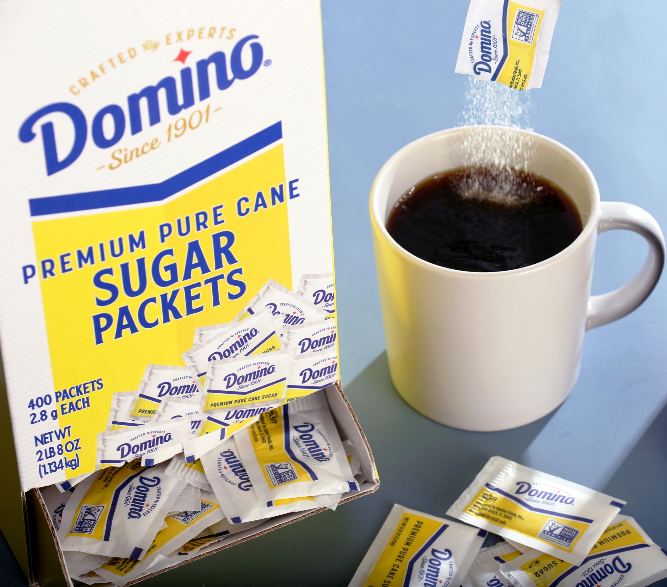 Close-up of Domino sugar packets with pre-measured 2.8 g portions