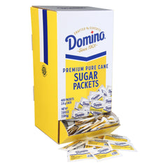 Domino sugar packets in a dispenser box for quick self-serve sweetness