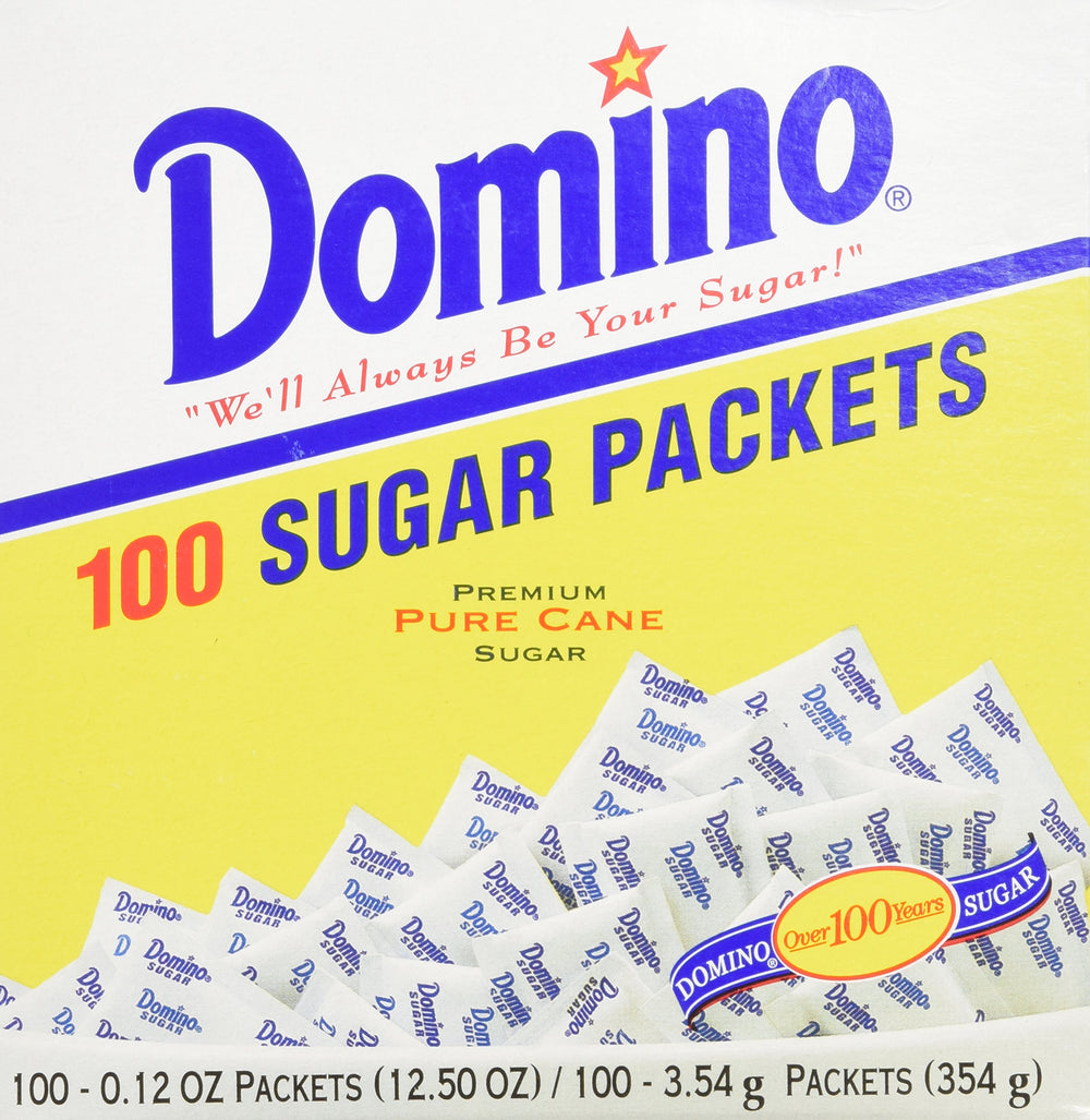 Domino sugar packets on kitchen counter for organized sweetness at hand.