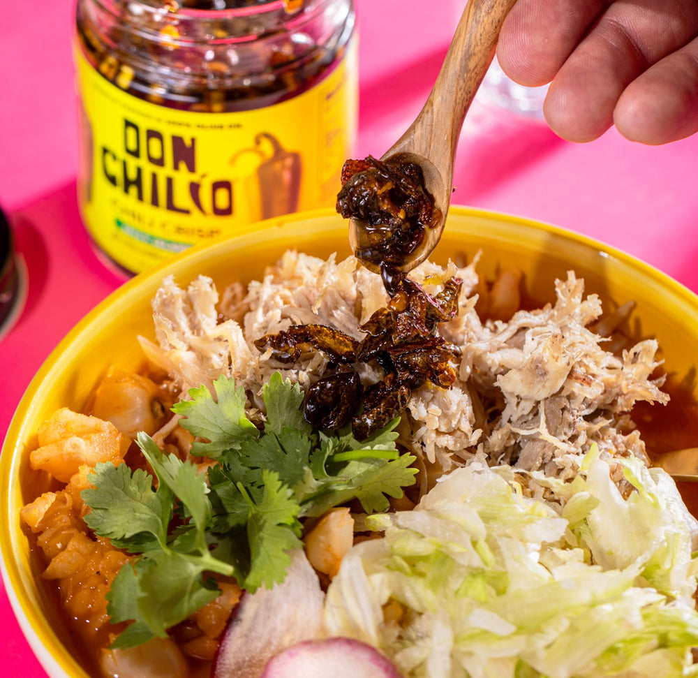 Don Chilio Mild Jalapeño Chile Crisp on pizza adds spicy crunch.