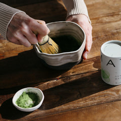 DONA hot water and matcha pouring into a cup creates a vibrant drink