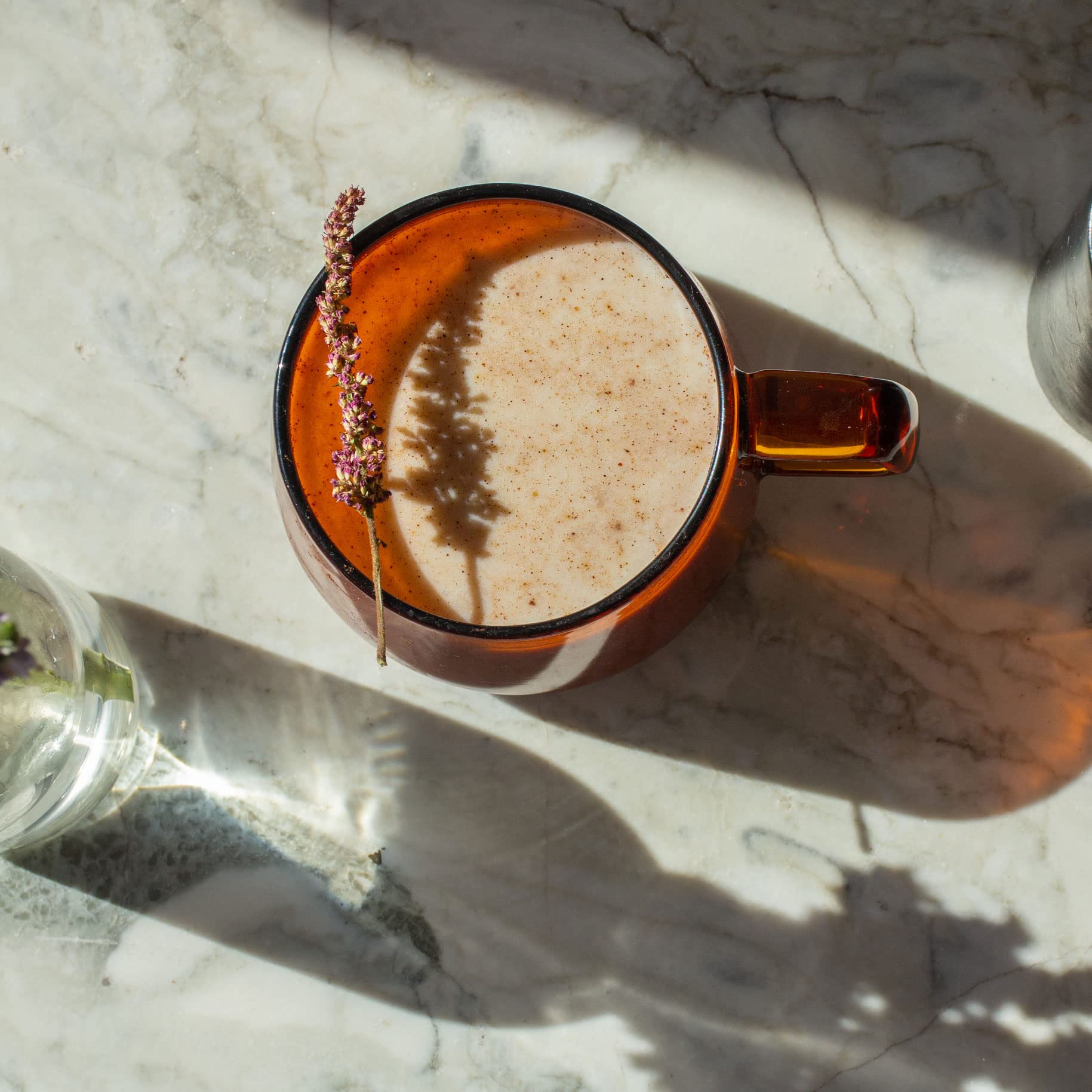 Steaming cup of Dona chai with spiced aroma