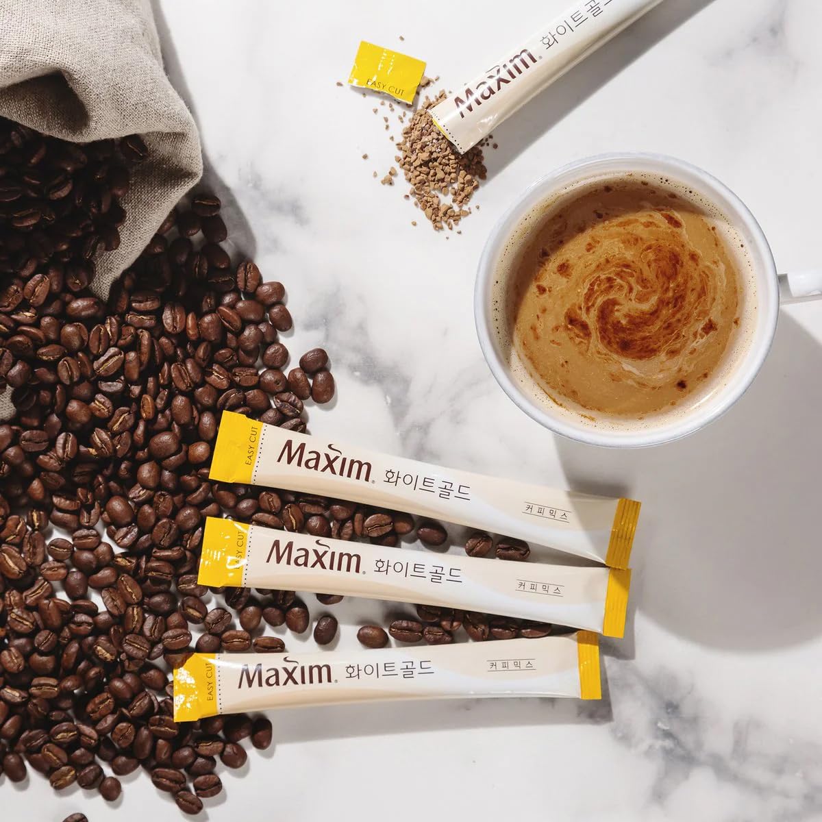 Dongsuh Maxim Mocha White Gold creamy mocha flavor in a cup.