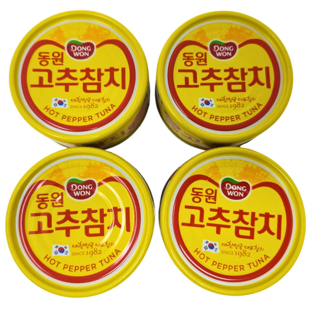 Four-pack of Dongwon tuna cans stacked for pantry convenience