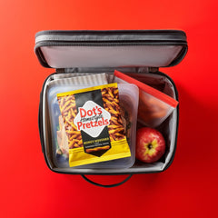 Dot's Homestyle Pretzels honey mustard arranged on a snack board for game night