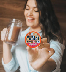 Double Donut Coffee Raspberry Chocolate close-up reveals glossy beans and creamy aroma.