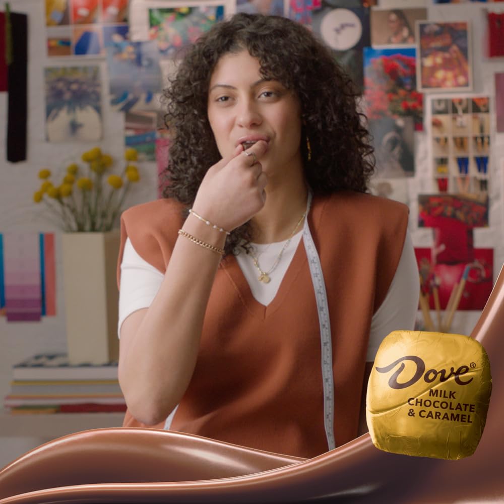 DOVE PROMISES velvety caramel complements milk chocolate for a balanced bite.