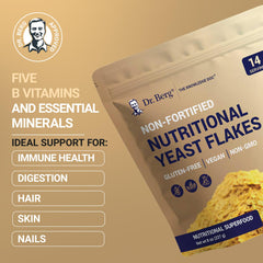 Dr. Berg Premium Nutritional Yeast Flakes sprinkling on salad demonstrates a savory, healthy topping option.