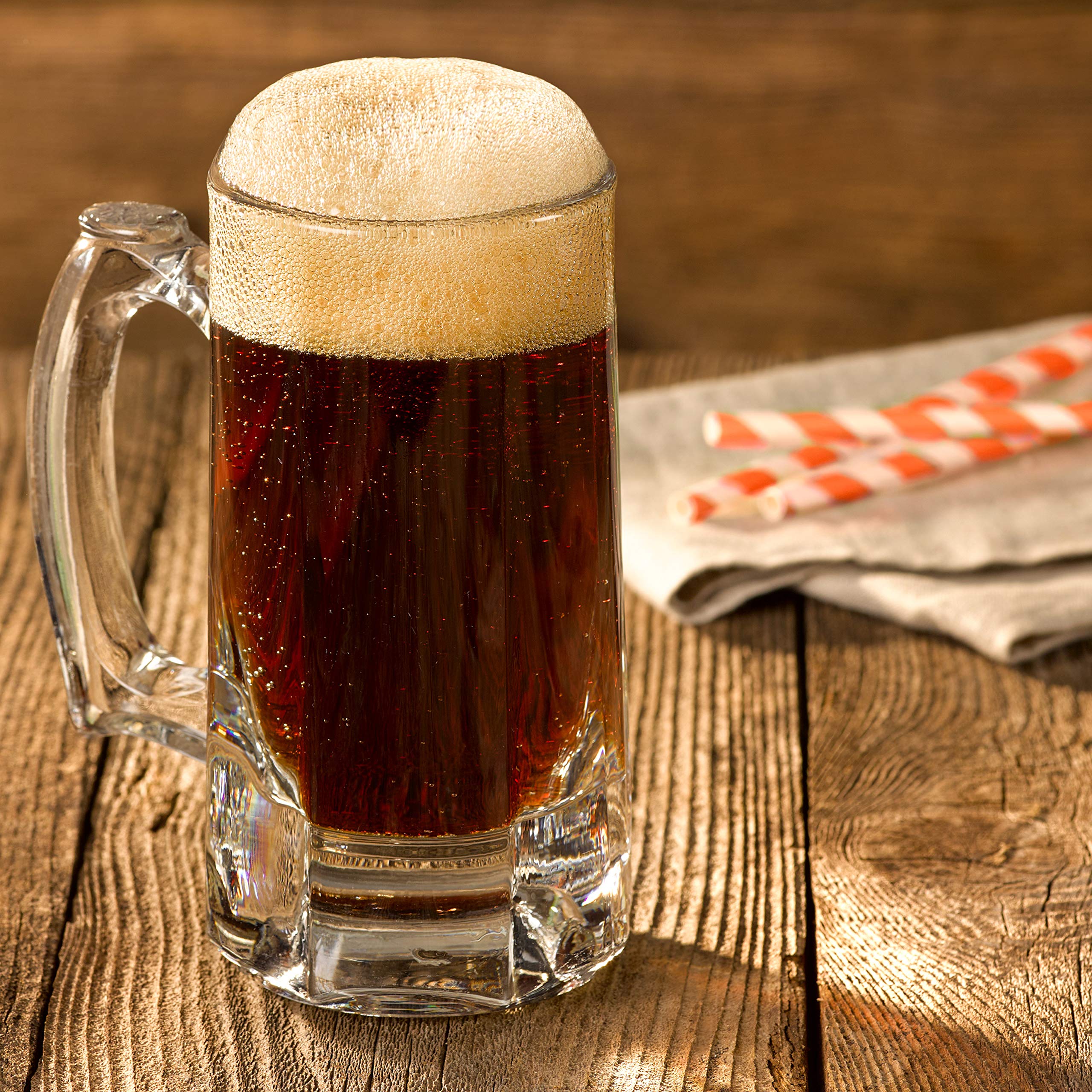 Dr Pepper A&W Root Beer pouring into a chilled glass with bubbles.