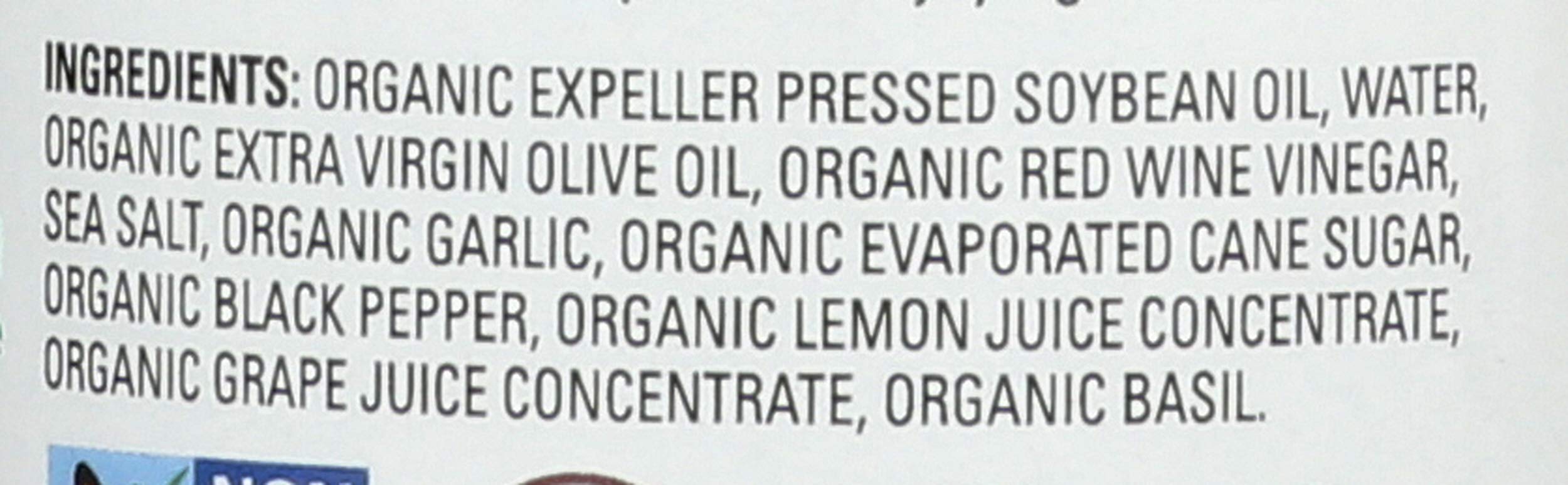 Drew's All Natural Organic Italian Dressing ingredients close-up showing herbs and oils.