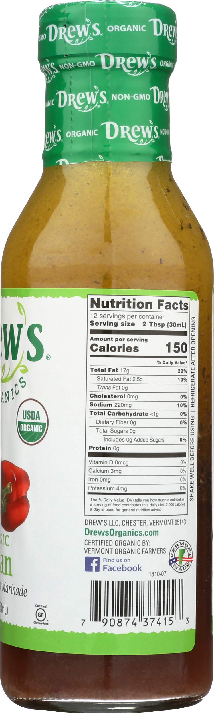 Drew's All Natural Italian Dressing being poured over fresh greens.