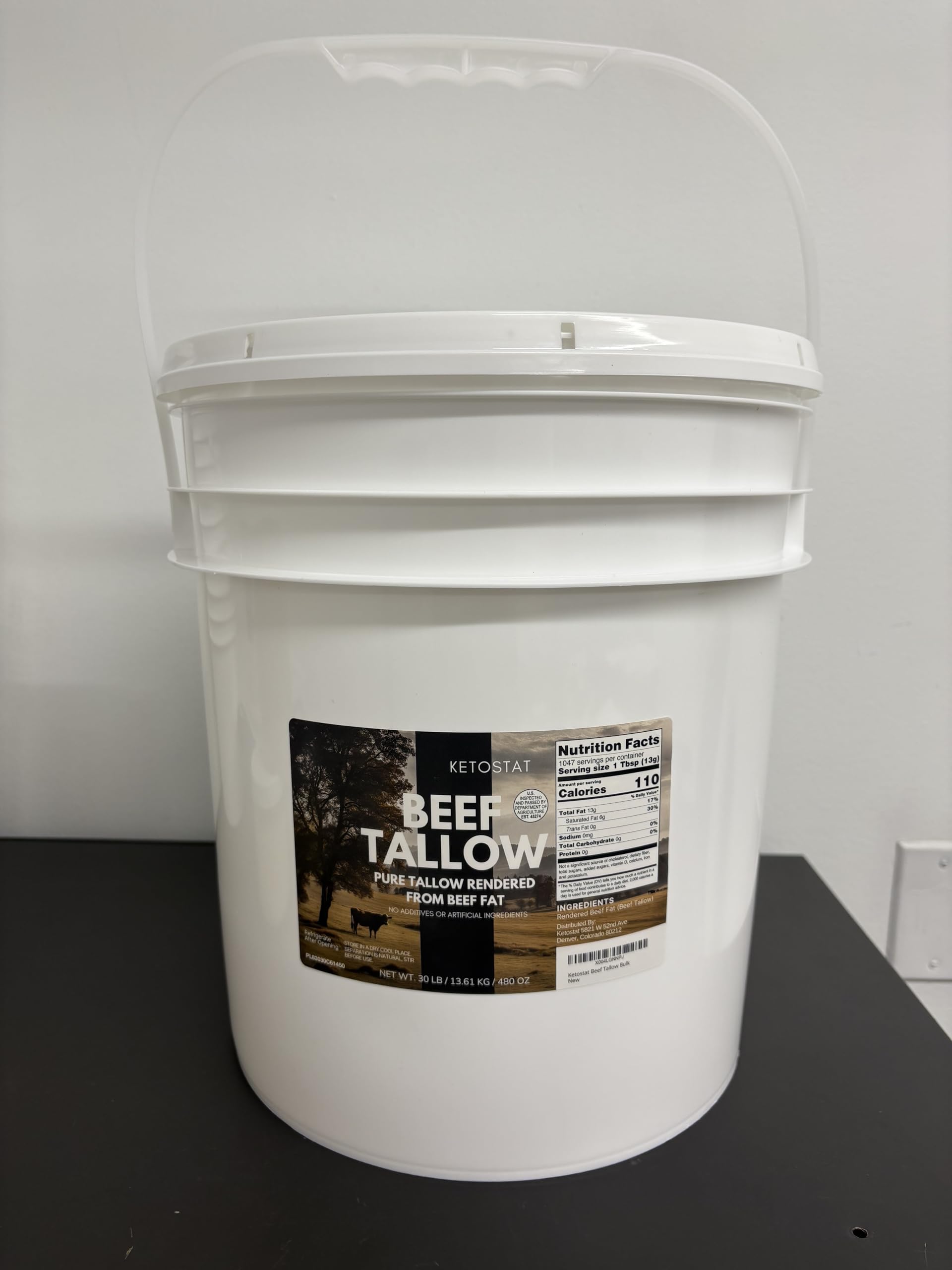 Drip Co beef tallow bulk pail kitchen setup for batch cooking
