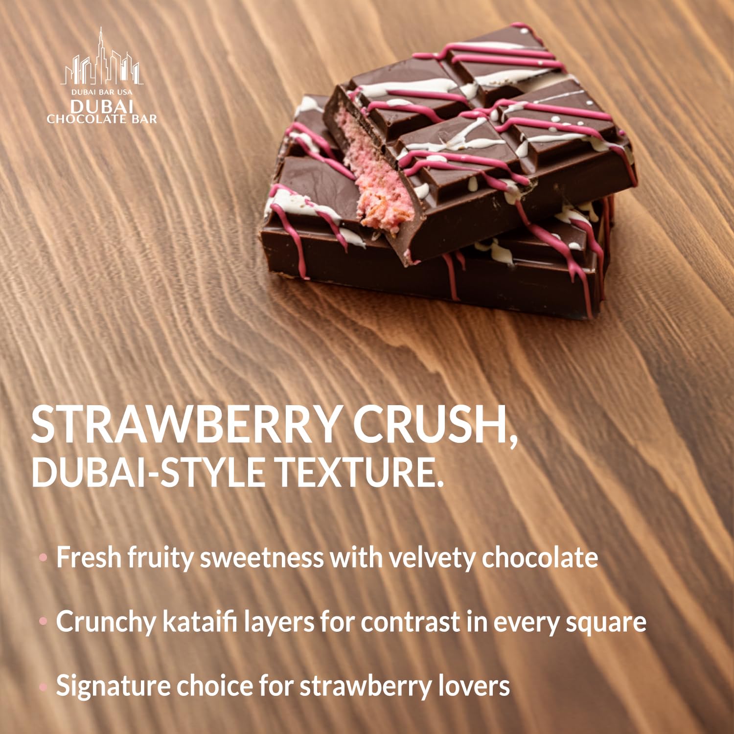 Sliced Dubai Choco Strawberry Crush reveals strawberry cream and chocolate layers.
