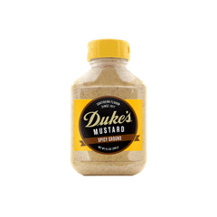 Duke's Spicy Ground Mustard bottle pour highlights bold, creamy heat for sandwiches