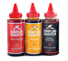 Dumpling Daughter spicy sweet soy trio bottles displayed for dumplings and stir-fries.