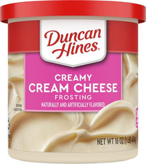 Duncan Hines Creamy Cream Cheese Frosting brownie topping adds tangy sweetness.